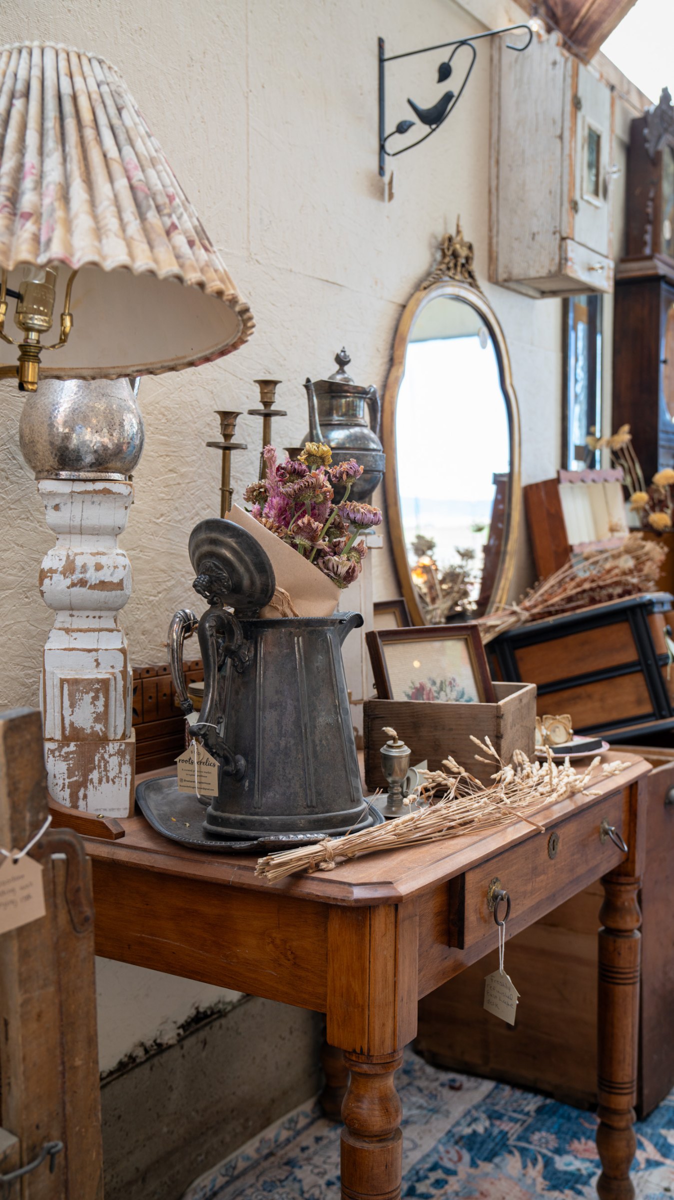 Vanity mirror and vintage bottles on a wooden table