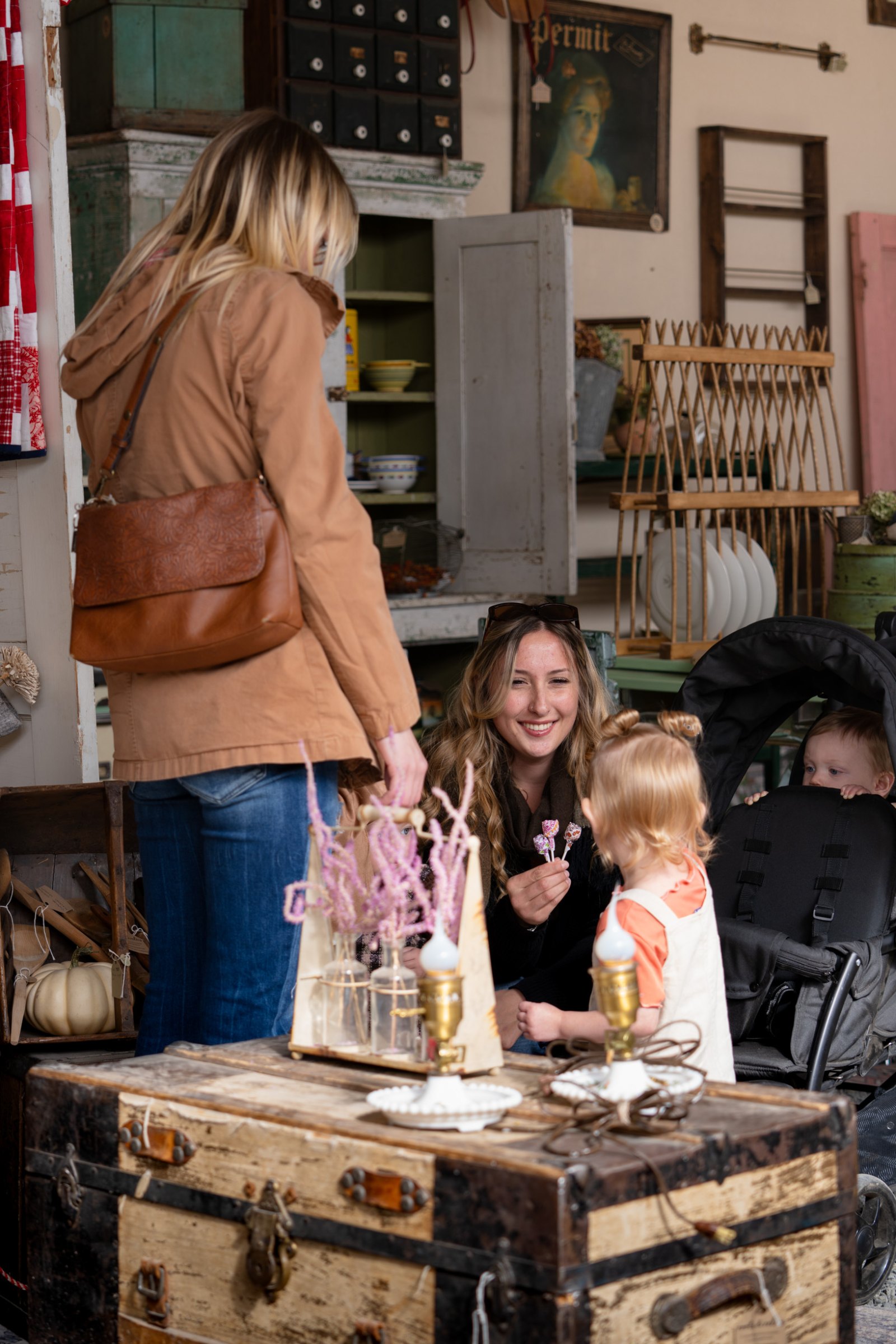Visitors gathered around a greenhouse display table