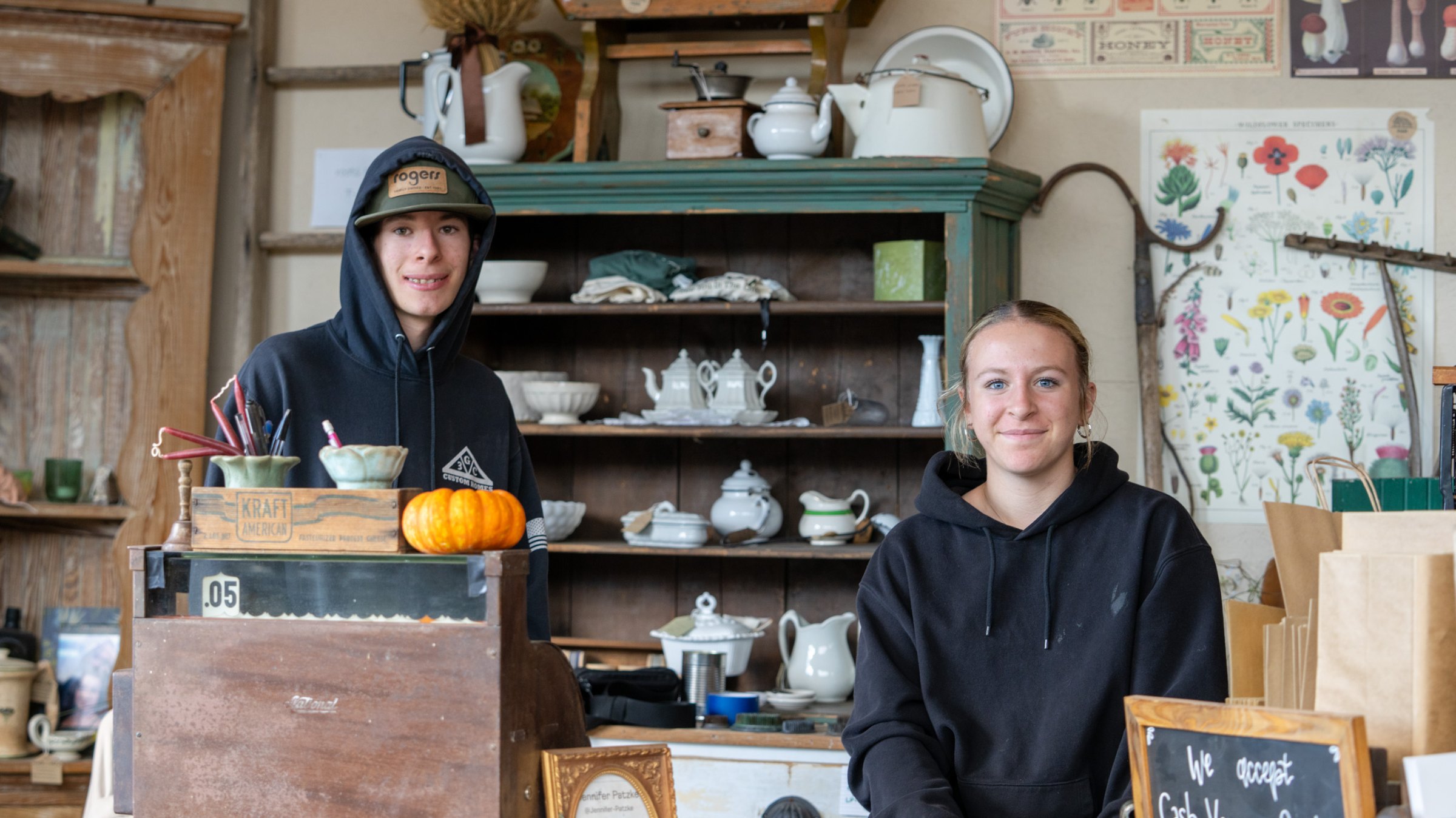 Two people behind the gathering counter