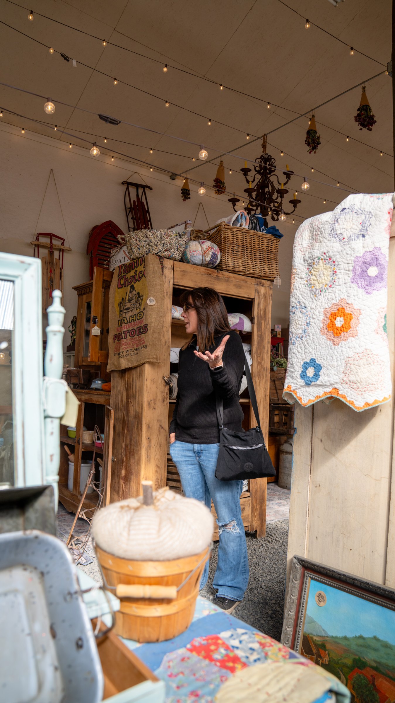 Visitor browsing colorful vintage displays in the greenhouse