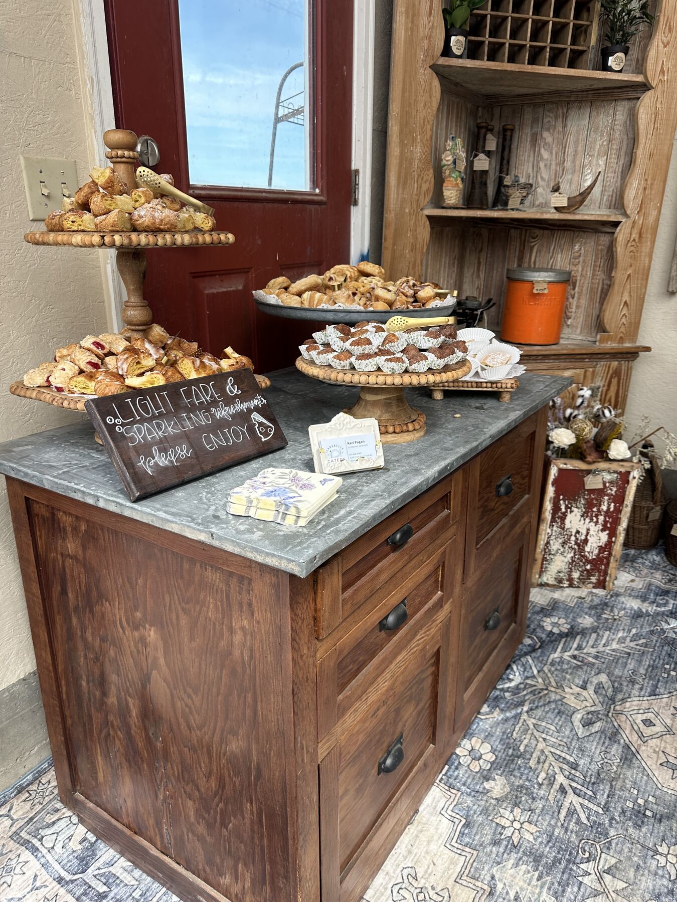 Pastries and small treats arranged on antique serving pieces