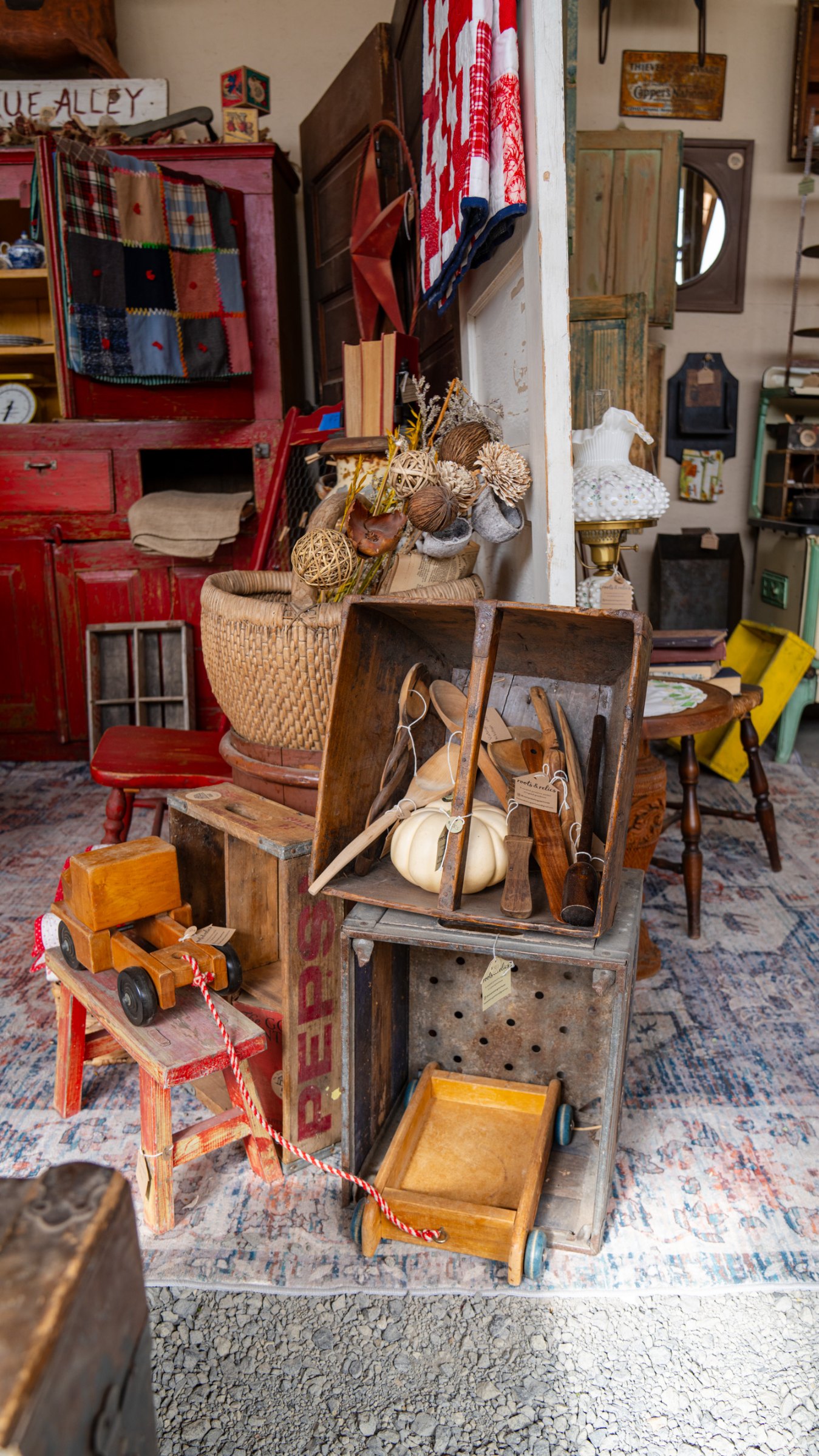 Easel and vintage decor against red shutters
