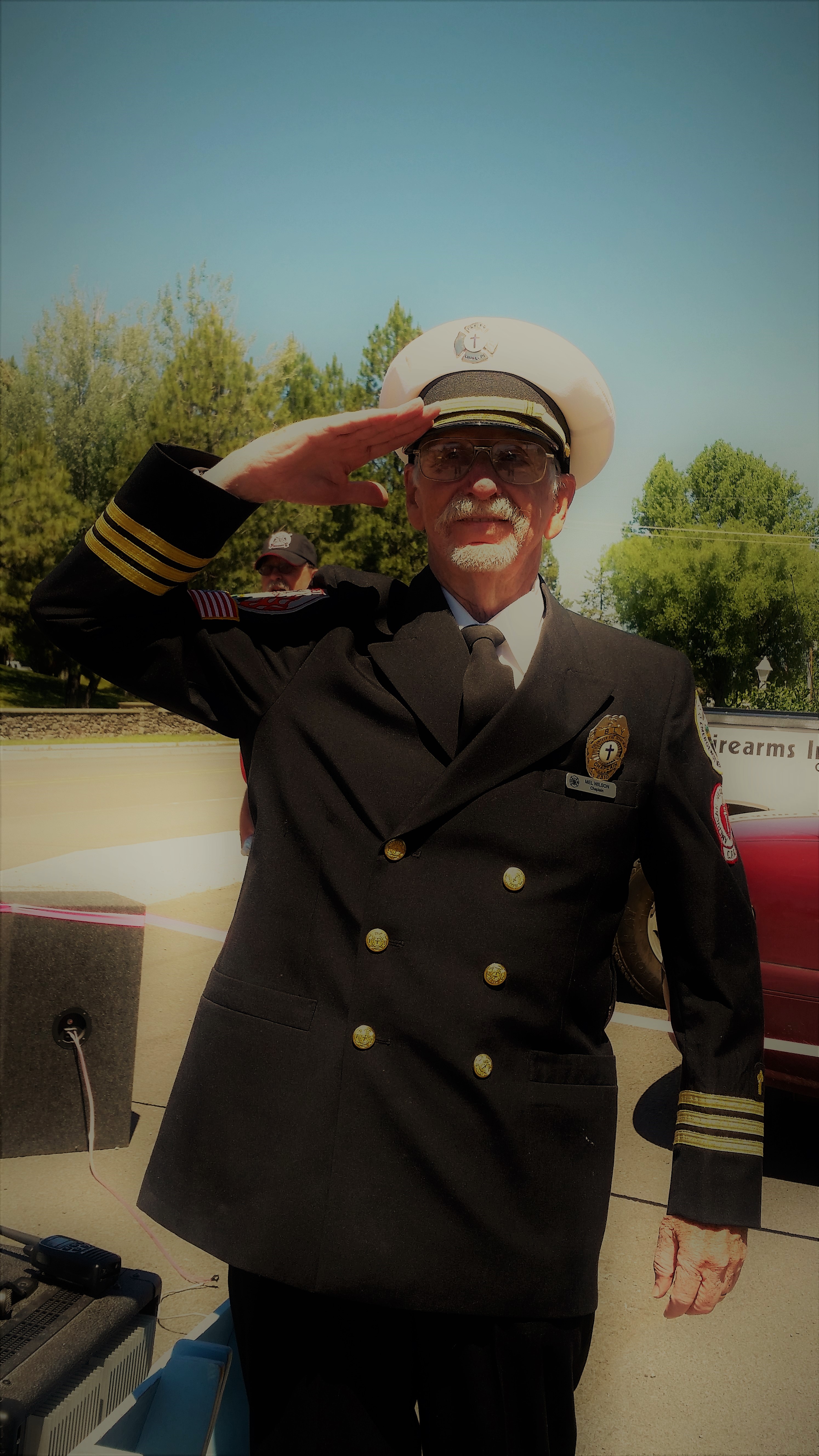 Chaplain Mel Wilson in uniform, saluting