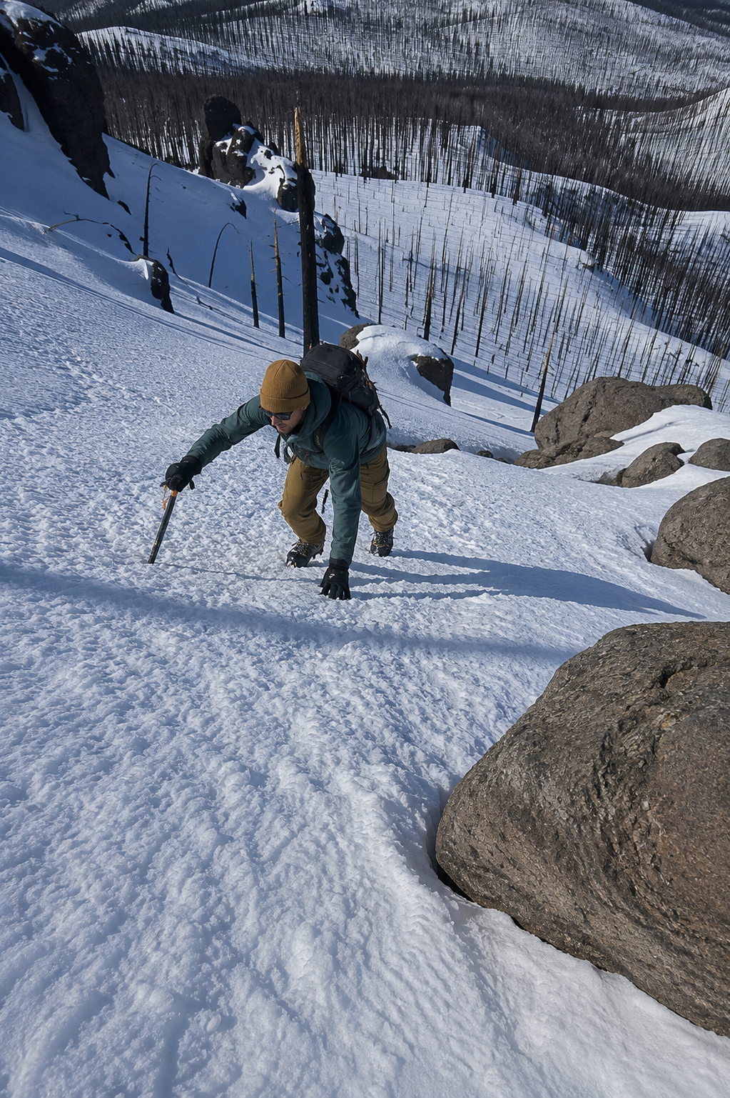Climber ascending a snowy slope