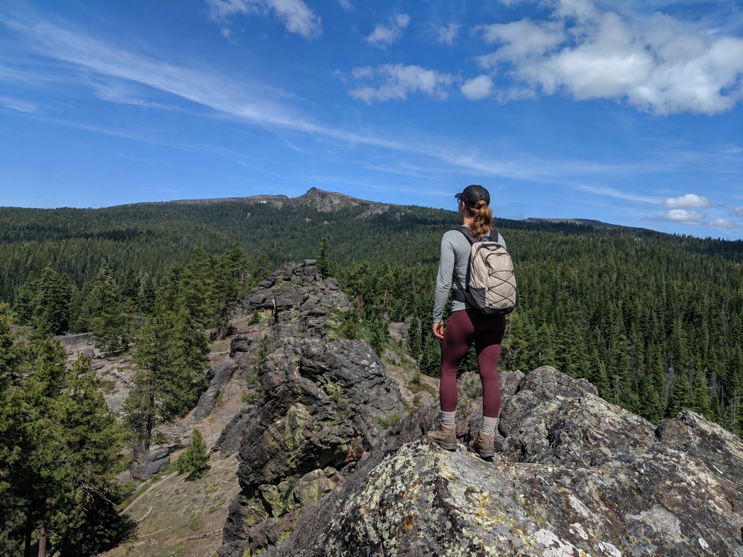 Hiker overlooking the forests and rocky landscape near Bly, Oregon